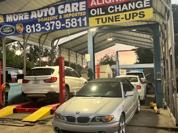 A silver BMW convertible parked in an outdoor bay during professional auto repair and maintenance services by BMW and More Auto Care LLC.